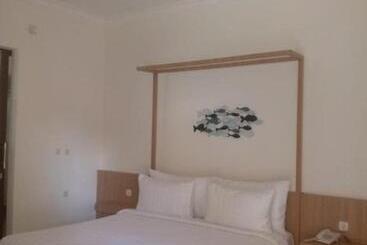 تختخواب و صبحانه New Belitung Holiday Resort