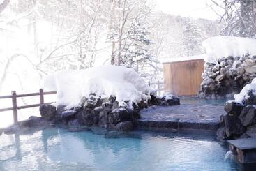 Отель Tomuraushionsen Higashi Taisetsuso