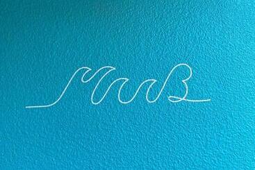 فندق صغير 奄美ゲストハウス Hub A Nice Inn