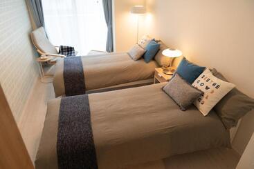 Апарт-отель Osaka Sunshine Tower21 L女性専用l