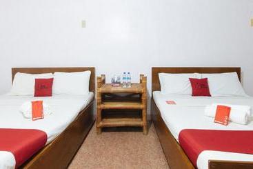 هتل Reddoorz Hostel At Megans Paradisio Beach Resort