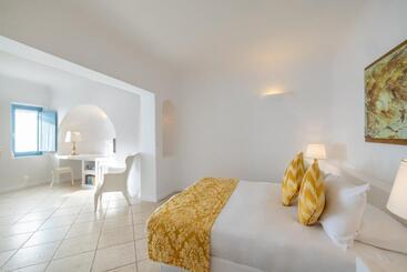 Отель Above Blue Suites