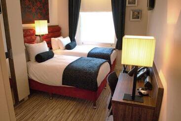 فندق Simply Rooms & Suites