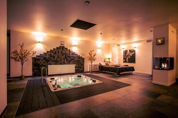 צימר Maas En Waal Wellness & Suites