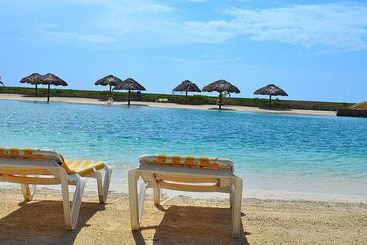 酒店 Parrot Tree Beach Resort