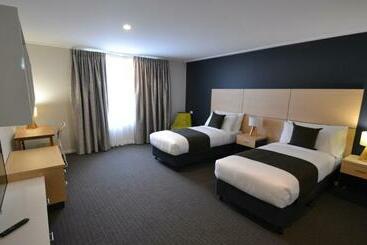 Отель The Astor Suites