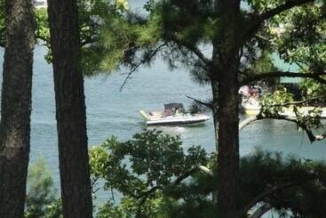 Lake View Two Bedroom, Two Bath Log Sided Cottage With Private Hot Tub Overlooking Lake Ouachita. By