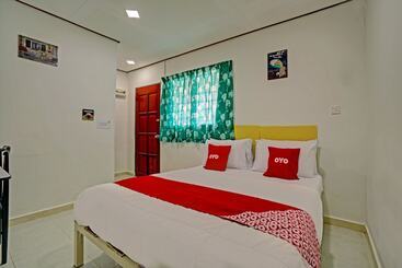 ホテル Capital O 90423 Teratai Chalet