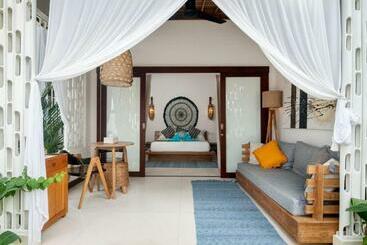 تختخواب و صبحانه De Coco Bungalows