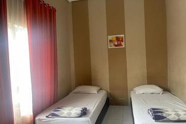 בית מלון כפרי Oyo 92502 Penginapan Rokan Permai Syariah