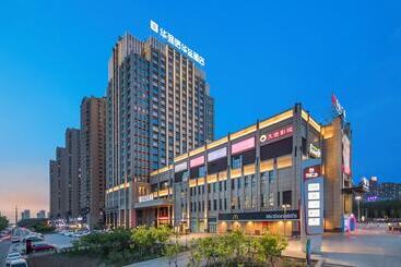 Отель Shenyang Huaqiang Novlion