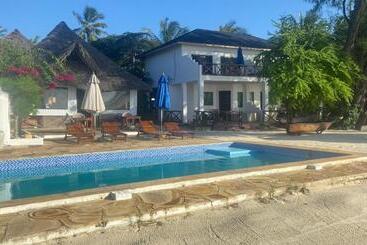 בית מלון כפרי Kaure Sand Beach Lodge