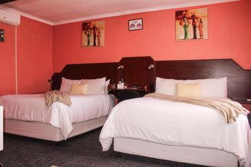 Отель Motherland Guest House