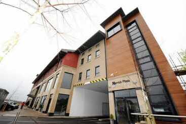 酒店 Carrick Plaza Suites & Apartments