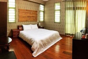 تختخواب و صبحانه Cao Ling Jiao Villa