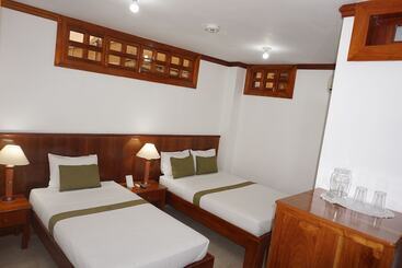 تختخواب و صبحانه Hostal Macaw