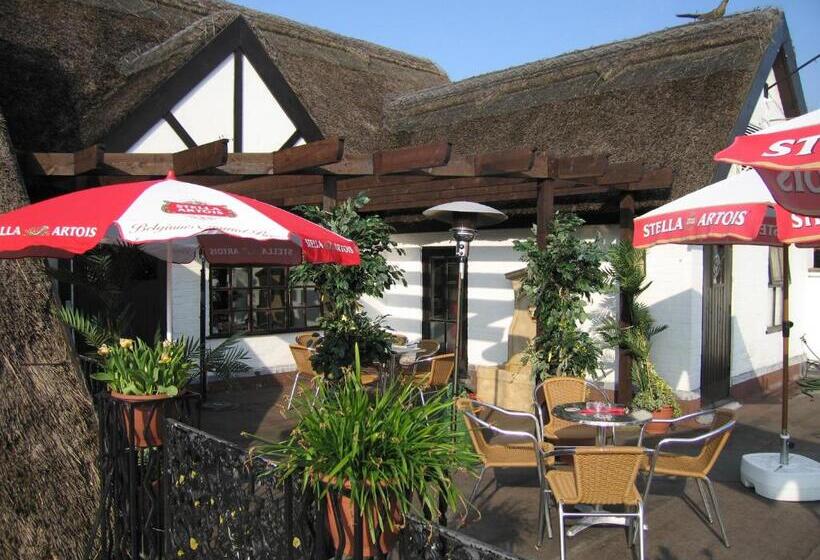 호텔 Guy's Thatched Hamlet