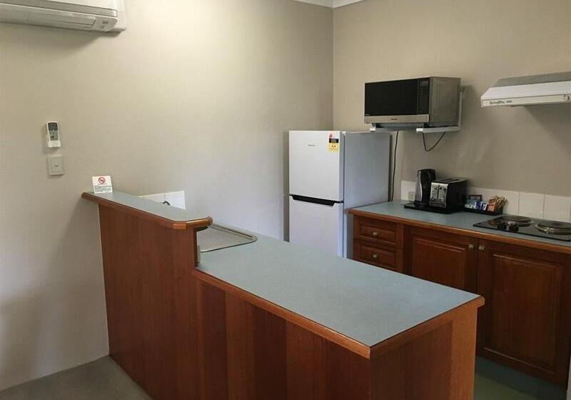 Отель The Belmore Apartments