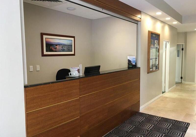 Отель The Belmore Apartments