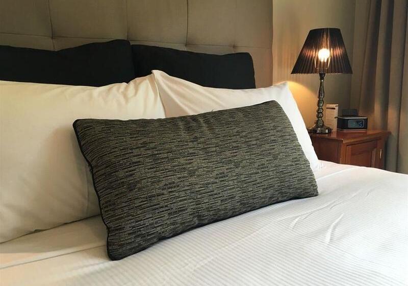 Отель The Belmore Apartments