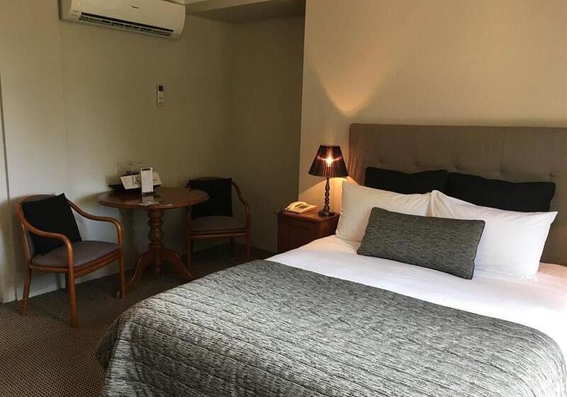 Отель The Belmore Apartments