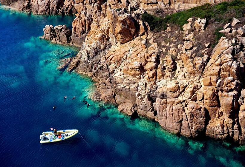 Отель Baia Di Chia Resort Sardinia, Curio Collection By Hilton