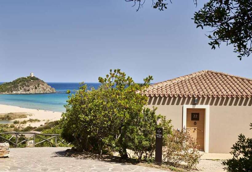 בית מלון כפרי Baia Di Chia Resort Sardinia, Curio Collection By Hilton