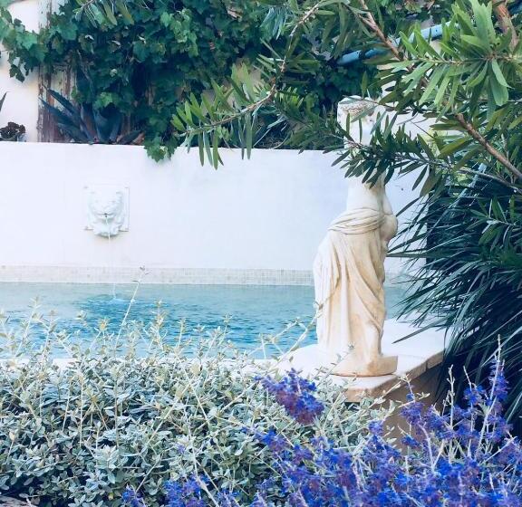 مبيت وإفطار O Palmier Caché