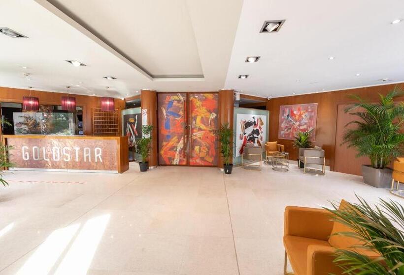 Отель Goldstar Apartments & Suites