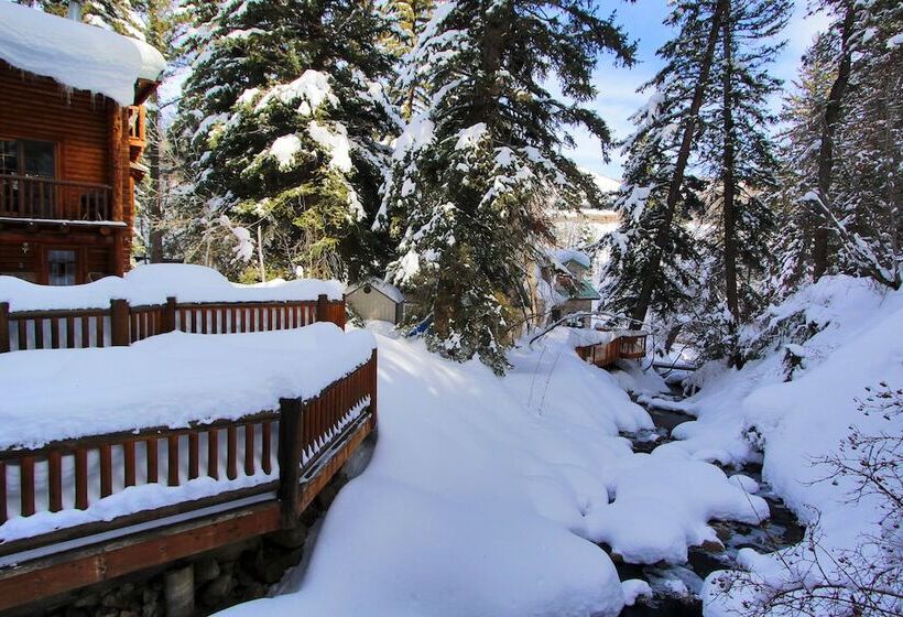 Log Cabin On The Stream
