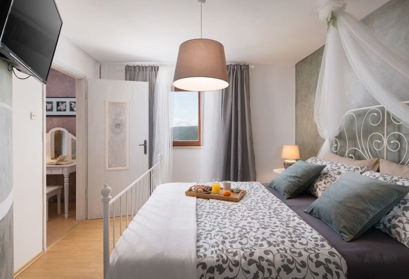 Surrounded By Beautiful Mediterranean Vegetation And The Crystal Clear Sea