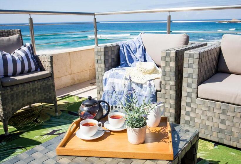 بنسيون Waves Of Grace Seafront Villa