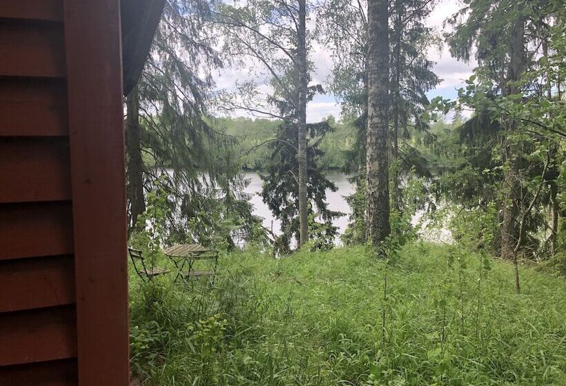 Tiny Hut In The Forest Overlooking The River