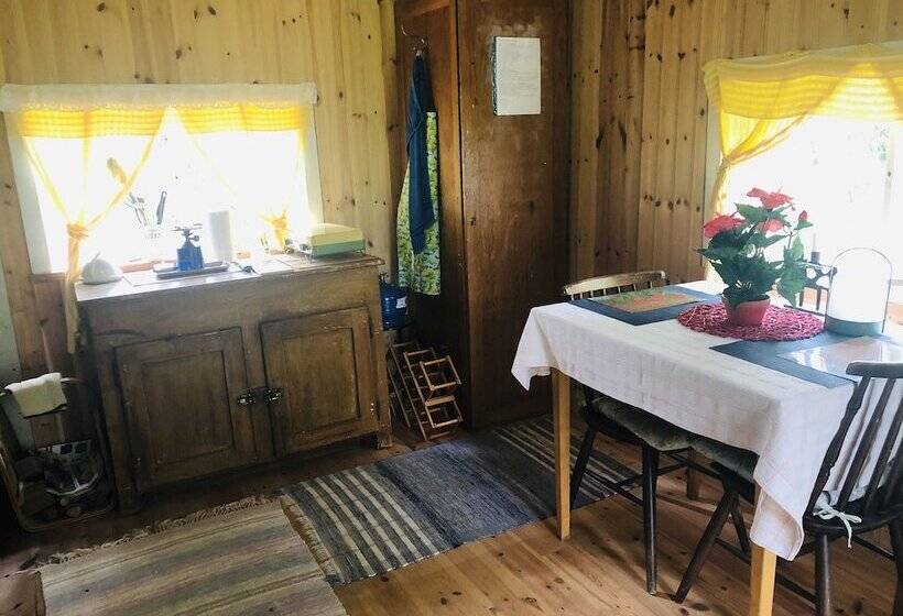 Tiny Hut In The Forest Overlooking The River