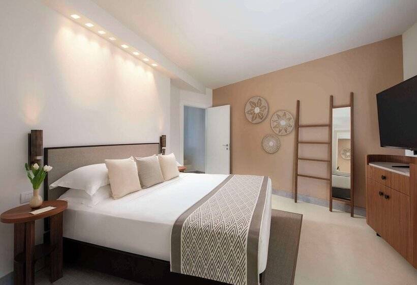 בית מלון כפרי Baia Di Chia Resort Sardinia, Curio Collection By Hilton