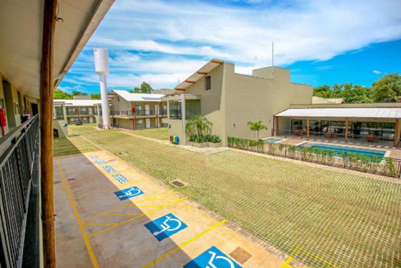 Отель Promenade Bonito All Suites