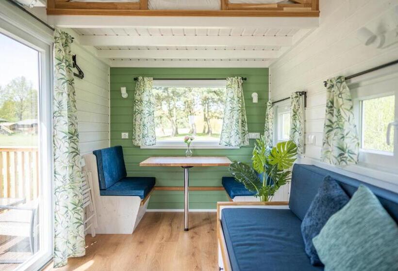 Green Tiny House With Shared Pool