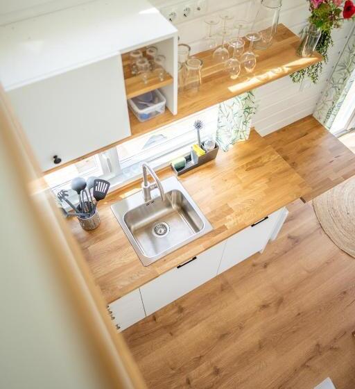 Green Tiny House With Shared Pool