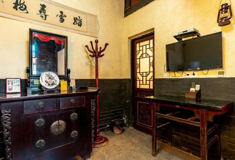 Отель Pingyao Ji Family Courtyard Inn