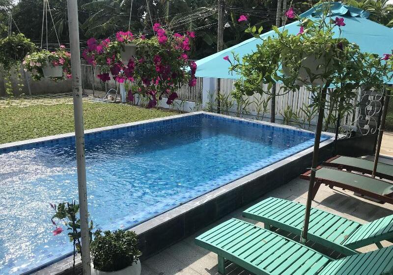 تختخواب و صبحانه The Moon River Homestay & Villa