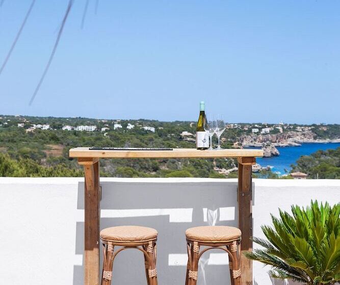 펜션 Hostal Cala Llombards