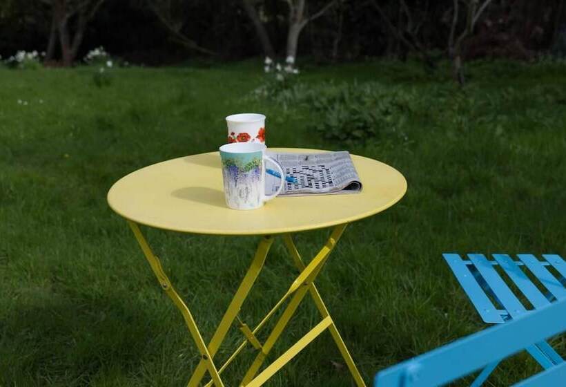 A Quirky Garden Building In An Orchard