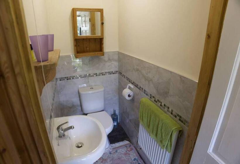 A Quirky Garden Building In An Orchard