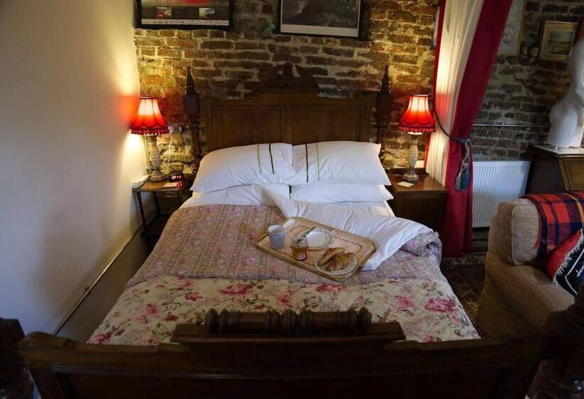 A Quirky Garden Building In An Orchard