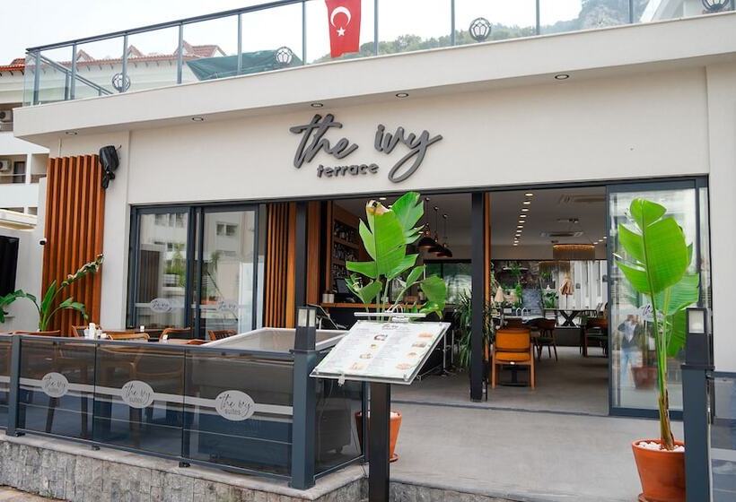 Отель The Ivy Suites