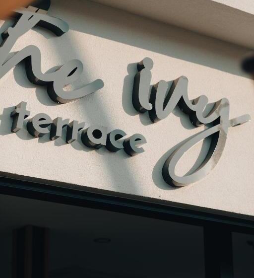 Отель The Ivy Suites