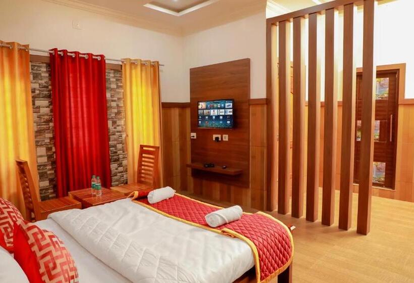 호텔 Edakkal Home Stay