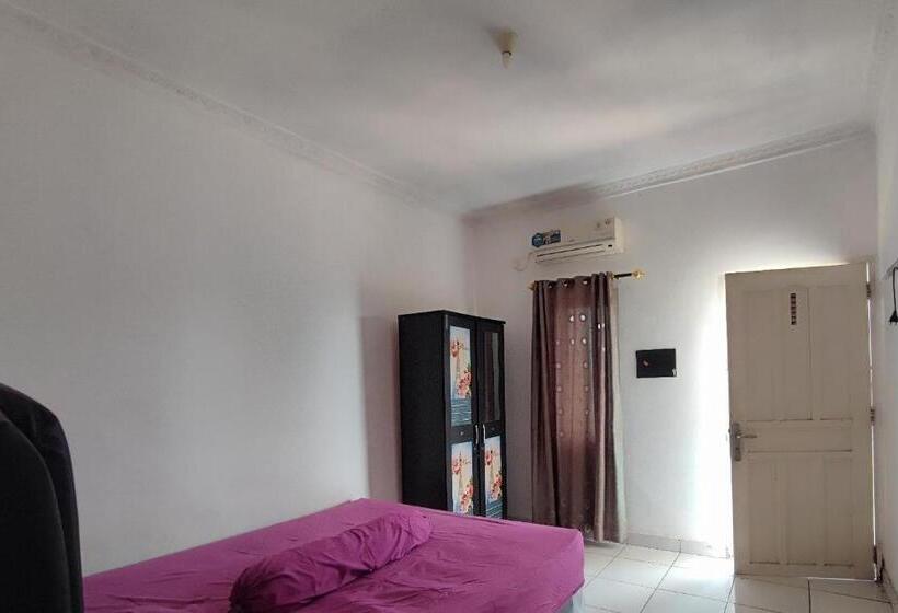 Отель Oyo 93252 Garuda Bandara Guesthouse