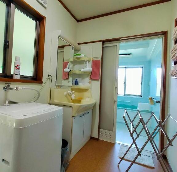 Пансион 奄美ゲストハウス宇宿サンライズビーチ