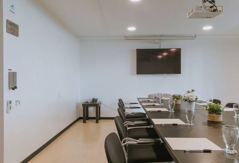 Отель Travelers Orange Suites